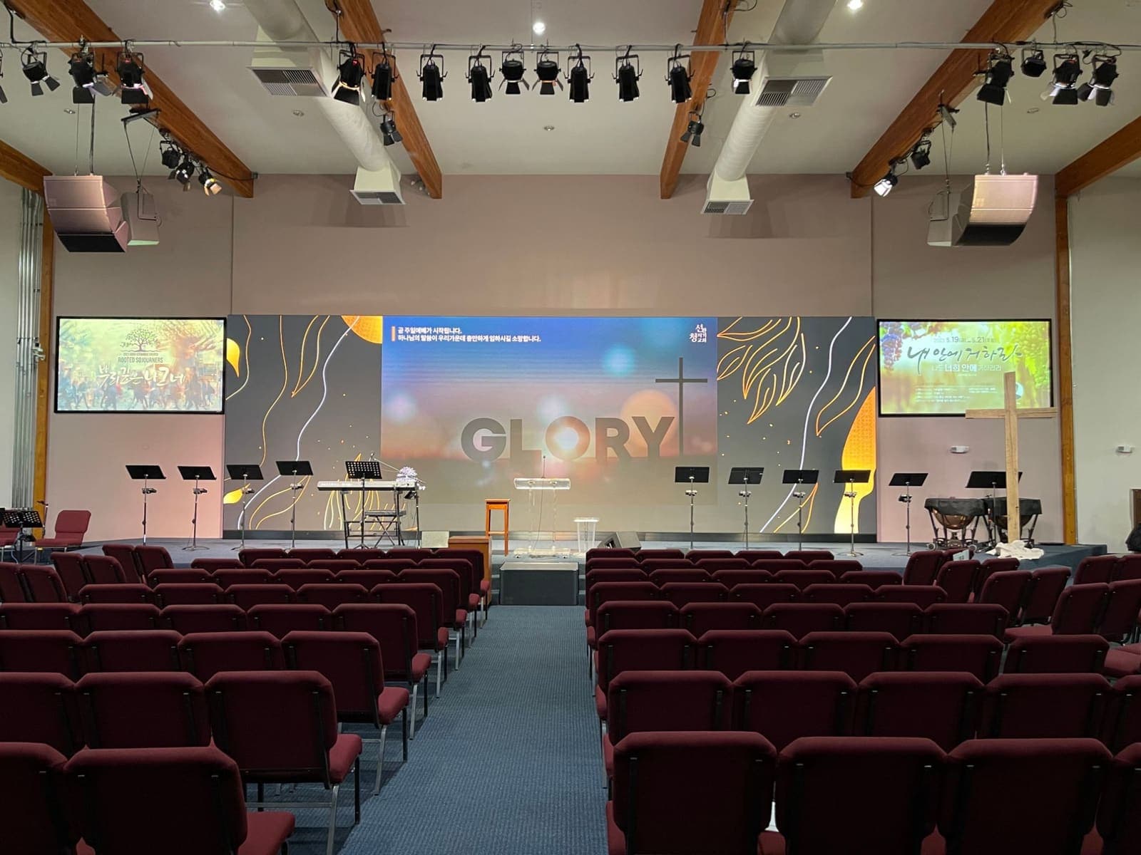 Good Stewards Church: main wall and two side screens across the stage